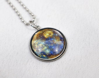 May include: A silver chain necklace with a round pendant featuring a colorful image of Jupiter, the largest planet in our solar system.