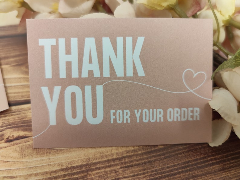 May include: A pink thank you card with white text that says "Thank You for your order" and a white heart.