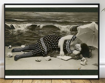 May include: A black and white photo of a woman sleeping on a beach with a book and an umbrella. She is wearing a polka dot swimsuit and has her hair pulled back. The photo is framed in a black frame.