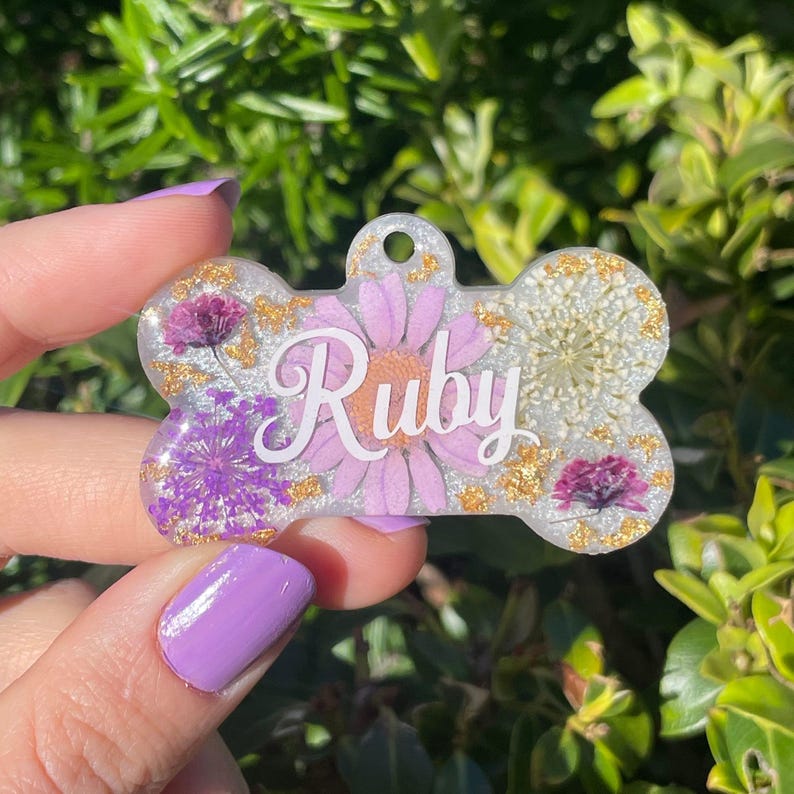Front side of purple floral dog tag, floral dog tag, purple and white dog tag, dog bone tag