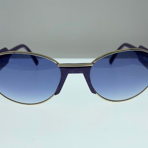 Beautiful vintage sunglasses  by Silhouette model m 8019, made in Austria, 80s sunglasses with purple frame and gradient lenses.