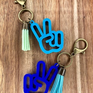 Signo de la paz, gesto con la mano, llavero