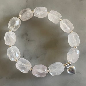 Faceted rose quartz and sterling silver love heart bead stretch bracelet