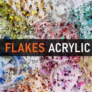 May include: Assortment of clear acrylic coasters with various iridescent glitter flakes embedded in the resin. The coasters are arranged in a random pattern and feature different colors of glitter, including gold, silver, pink, blue, and green.
