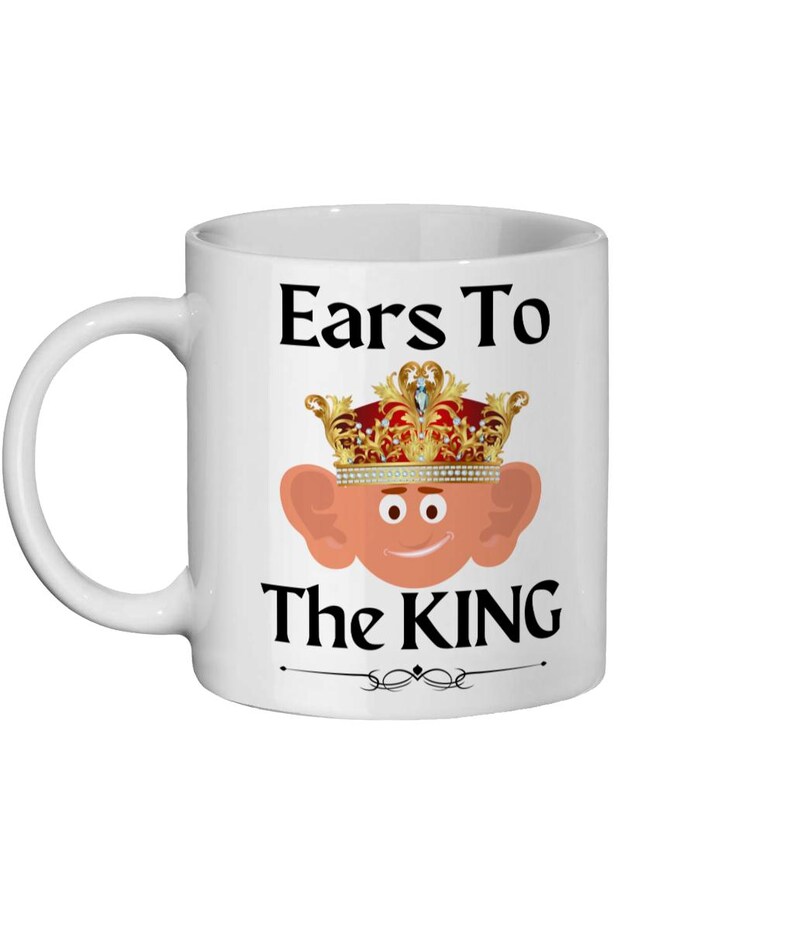 Cartoon king Charles with big ears on an 11oz ceramic mug, showcasing a playful and colorful royal design with a detailed crown and a friendly face and the text 'Ears to the King'