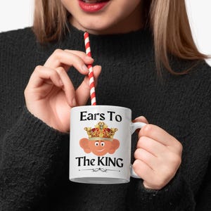 Unique ceramic coffee mug, 11oz, with a cute cartoon king Charles character with large ears and a golden crown, with the text ' Ears to the King' ideal for fans of the royal family, monarchy and humorous gifts
