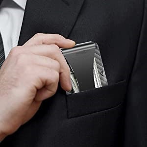 Smart Wallet being placed in a front jacket pocket