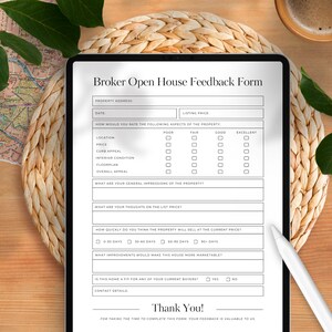 May include: A digital tablet showing a "Broker Open House Feedback Form" with sections for property details and ratings. A stylus lies on the right. A cup of coffee and foliage are in the background, set on a woven mat.