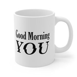 May include: White ceramic coffee mug with black text that reads "Good Morning YOU".