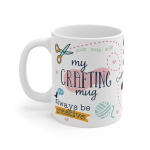 May include: White ceramic mug with a pink and blue design. The mug says "My Crafting Mug" and "Always Be Creative".