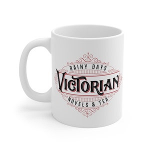 May include: White ceramic mug with a black and red design that says "Rainy Days Victorian Novels & Tea".