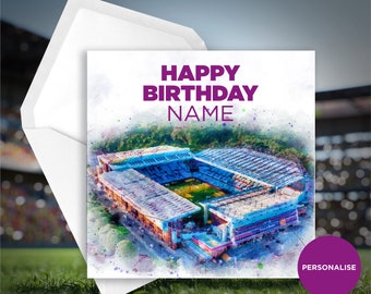 May include: A personalized birthday card featuring a watercolor illustration of a stadium with the text "Happy Birthday NAME".