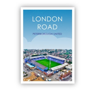 May include: An aerial view of London Road, the home ground of Peterborough United Football Club. The stadium is surrounded by a residential area and has a blue and white colour scheme.