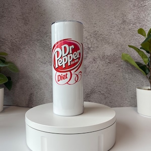 May include: White stainless steel tumbler with a red and white Dr Pepper logo and the words "Diet" and "Est. 1885".