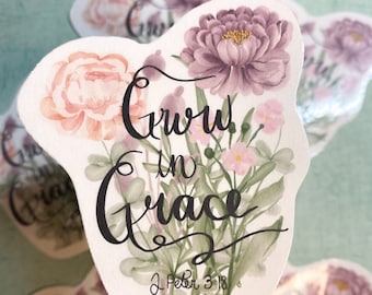 May include: Watercolor stickers with floral designs and the phrase "Grow in Grace" in elegant script. The stickers feature pink and purple flowers, green leaves, and the Bible verse J. Peter 3:18.
