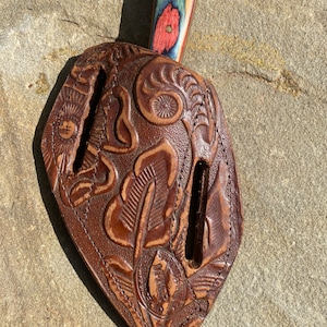 Vintage, antique, tooled leather knife, sheath from my old saddle. Knife is not included.
