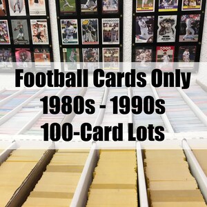 May include: A collection of football trading cards from the 1980s and 1990s, organized in rows of white boxes. Each box contains 100 cards. The text "Football Cards Only 1980s - 1990s 100-Card Lots" is displayed above the boxes.