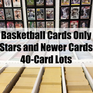 May include: A close-up of a shelf filled with rows of yellow card boxes. The boxes are labeled "Basketball Cards Only Stars and Newer Cards 40-Card Lots".