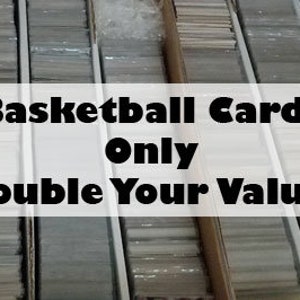 May include: Close-up of a collection of basketball cards in rows. The text on the sign reads "Basketball Cards Only Double Your Value!"