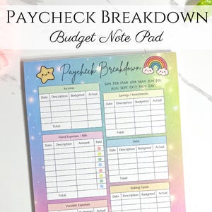 May include: A colorful budget note pad with the text "PAYCHECK BREAKDOWN" and "Budget Note Pad". The pad features sections for income, expenses, and savings, with a pastel rainbow and star design. The pad is designed to track finances.