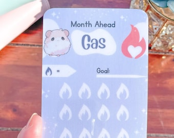 May include: A light blue printable tracker with a cartoon hamster, a red flame with a heart, and the text "Month Ahead Gas". The tracker has 20 white flame icons and the text "You're on Fire! Little Potato Saver".