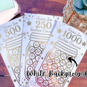 May include: Three gold-colored printable cards with a jar savings challenge theme. The cards are labeled "Golden Jar Savings Challenge" with the amounts $500, $250, and $1000. Each card has a jar with coins inside, with the amounts of the coins listed.