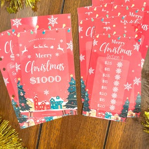 Pode incluir: Um imprim&iacute;vel vermelho de desafio de poupan&ccedil;a de Natal com um design festivo. O imprim&iacute;vel inclui uma se&ccedil;&atilde;o para poupar 1000 &euro; com uma meta de 25 &euro;, 15 &euro;, 20 &euro; e 15 &euro; por semana. O imprim&iacute;vel tamb&eacute;m inclui uma se&ccedil;&atilde;o para poupar 25 &euro;, 15 &euro;, 25 &euro;, 15 &euro;, 20 &euro;, 15 &euro; e 20 &euro; por semana.