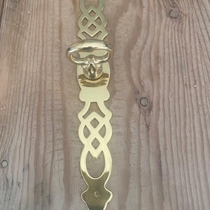 Solid brass cabinet pull with escutcheon. 5.25” x .75”