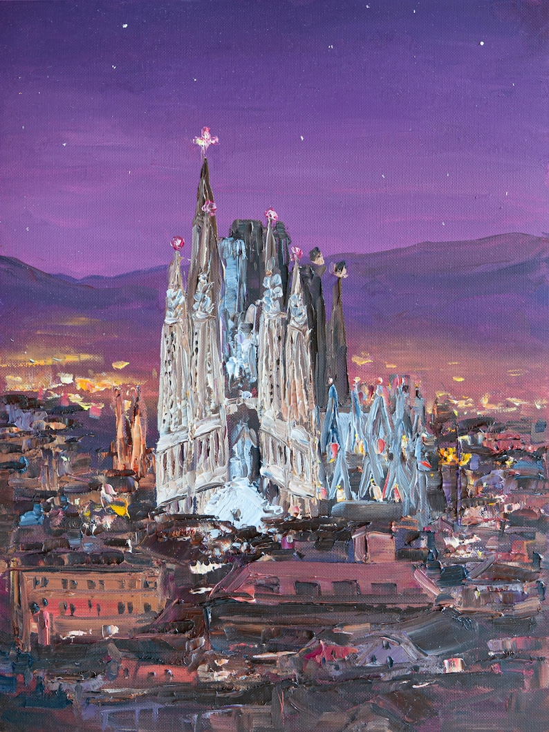 May include: An oil painting depicting the Sagrada Familia in Barcelona at night. The cathedral features tall, intricate spires against a deep purple sky with stars. The surrounding city is illuminated with warm yellow lights under a mountain range.