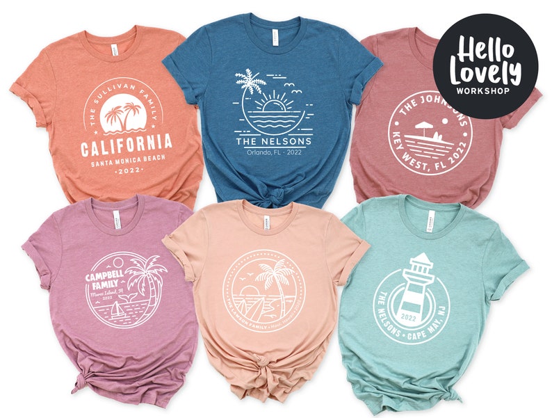 May include: Set of six t-shirts with different designs featuring a beach theme. Each shirt has a white circle with a design inside and text below. The text includes the family name, location, and year. The shirts are in different colors: orange, blue, pink, peach, and teal.