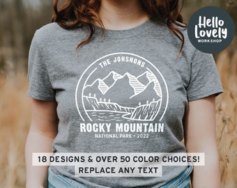 May include: Gray t-shirt with a white graphic design of mountains and the text "THE JOHSNONS ROCKY MOUNTAIN NATIONAL PARK 2022".