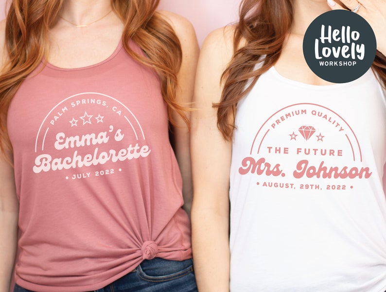 May include: Two white tank tops with pink text. The top on the left says "Palm Springs, CA Emma's Bachelorette July 2022." The top on the right says "Premium Quality The Future Mrs. Johnson August 29th, 2022."