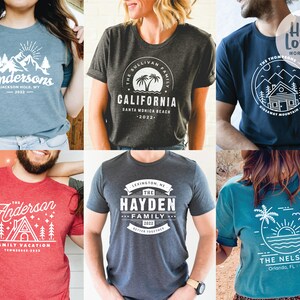 May include: Six different t-shirt designs featuring a variety of nature-inspired graphics, including mountains, palm trees, and a cabin. The shirts are all in different colors, including blue, red, gray, and teal. The text on the shirts includes the names "Anderson", "Sullivan", "Hayden", "Thompson", "Nelson", and "California".