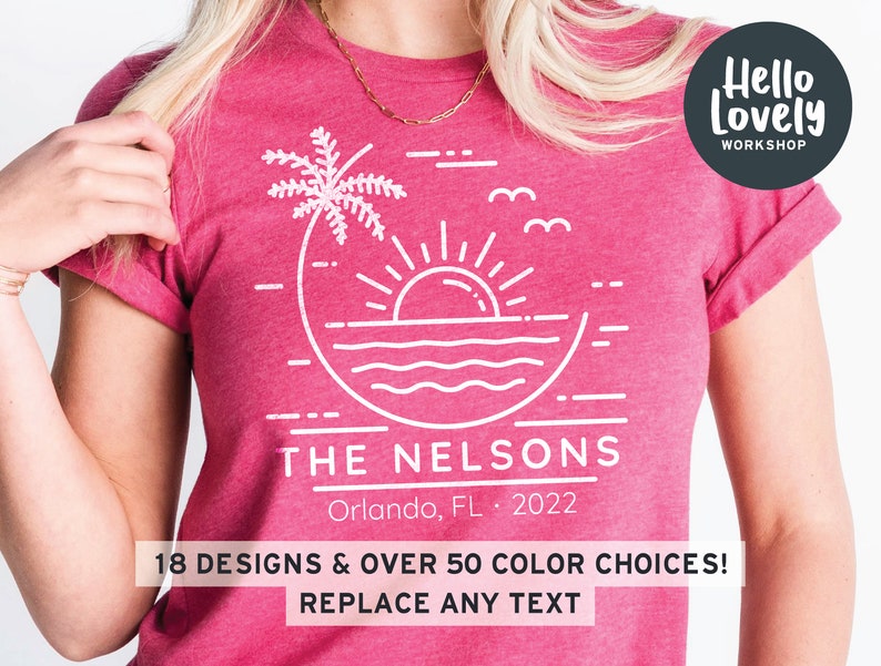 May include: A pink t-shirt with a white graphic design of a palm tree, sun, and ocean waves. The text "THE NELSONS" is below the graphic, along with "Orlando, FL 2022". The text "Hello Lovely WORKSHOP" is in a circle in the upper right corner of the shirt.