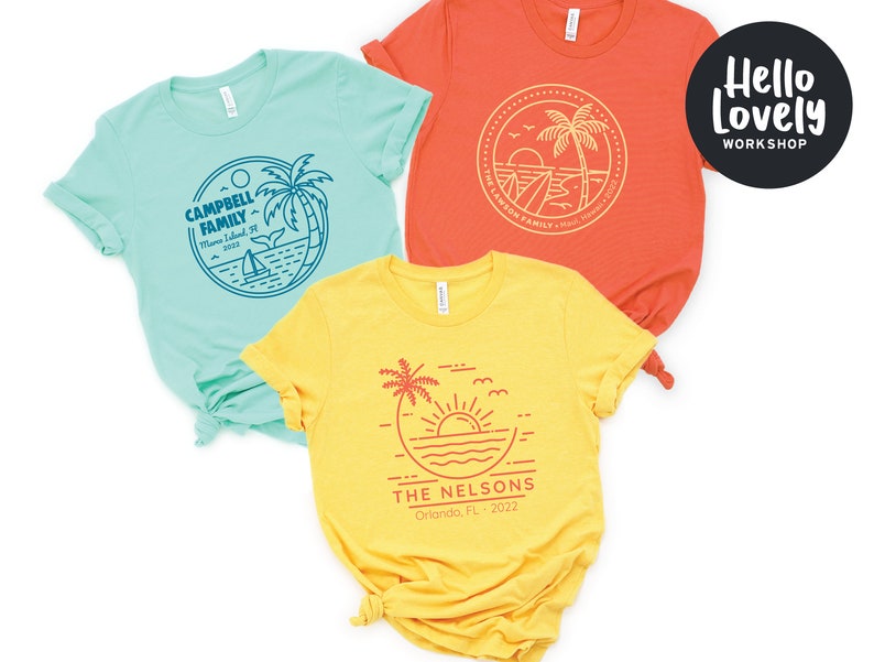 May include: Three t-shirts with a beach theme. The first t-shirt is light blue with the text "CAMPBELL FAMILY" and a palm tree. The second t-shirt is orange with the text "THE LANSON FAMILY" and a palm tree. The third t-shirt is yellow with the text "THE NELSONS" and a palm tree.