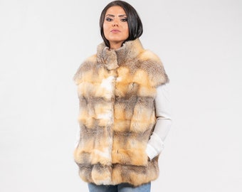 Modern real fox fur vest with short sleeves in a combination of white, grey and gold color. Genuine fox fur vest, ideal fur gift for women