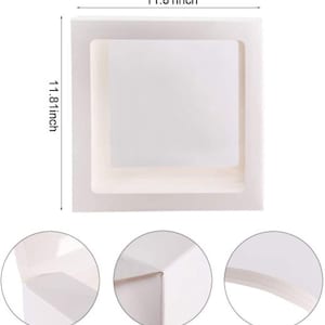 May include: White cardboard box with a square opening, measuring 11.81 inches in length and width. The box has a simple design and is perfect for packaging gifts or other items.