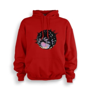 May include: Red hooded sweatshirt with a black and iridescent graphic of a sphere with a detailed design.