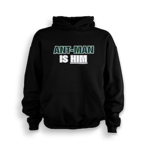 May include: Black hooded sweatshirt with the text "ANT-MAN IS HIM" in green and white lettering.