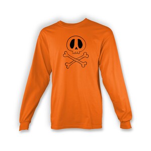 May include: Orange long-sleeve t-shirt with a black skull and crossbones graphic.