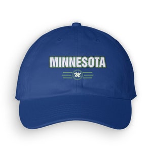 May include: A royal blue baseball cap with a white "MINNESOTA" text and a green "M" logo in a circle.