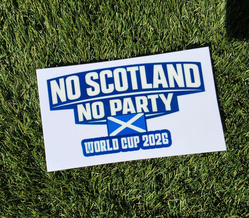 May include: A rectangular white sticker featuring the blue and white text NO SCOTLAND NO PARTY and WORLD CUP 2026. The design includes a small blue and white Scottish flag icon centered between the text lines, all rendered in a bold, blocky font.