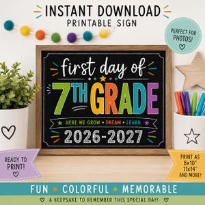 May include: A rectangular chalkboard-style sign in a wooden frame with the text first day of 7TH GRADE 2026-2027. The design features colorful lettering, stars, and decorative lines. The sign includes the text HERE WE GROW DREAM LEARN.