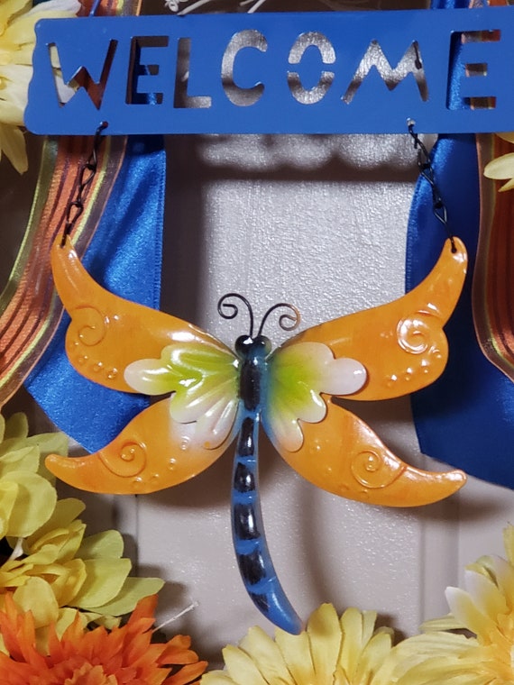 Welcome Wreath Reads \u201c Welcome \u201c with Dragonflies Flowers and Watering Bucket Perfect for Spring Time Hanging Door Wreath Welcome Wreath Reads \u201c Welcome \u201c with Dragonflies Flowers and Watering Bucket Perfect for Spring Time Hanging Door Wreath