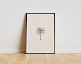 May include: A black framed print of a simple line drawing of a palm tree on a beige background.