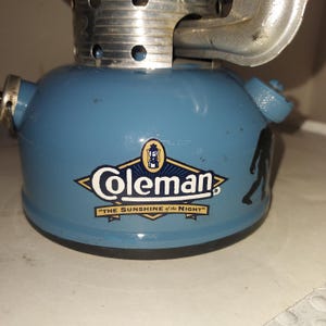 Vintage Coleman 502 stove, 1-1971, custom painted blue/black with sasquatch. .