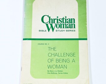 May include: A vintage book titled "Christian Woman Bible Study Series." The cover features a green and white design with the title in green. The book's title is "The Challenge of Being a Woman."