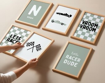 May include: A collection of framed wall art with a racing theme. The art includes checkered flags, race cars, and phrases like "VROOM VROOM" and "little RACER DUDE." The frames are light wood, and the backgrounds are various shades of green and white.