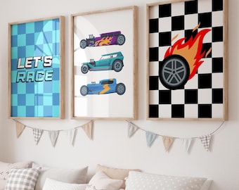 May include: Three framed wall art pieces with a racing theme. One features a blue and turquoise checkered pattern with the text "LET'S RACE." Another displays three colorful hot rod illustrations. The third shows a flaming tire on a black and white checkered background.