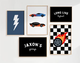 May include: A set of five framed wall art prints featuring a blue lightning bolt, two race cars with flame decals, the text LONG LIVE boyhood, the text JAXON'S garage, and a black and white checkered pattern with a flaming tire graphic.